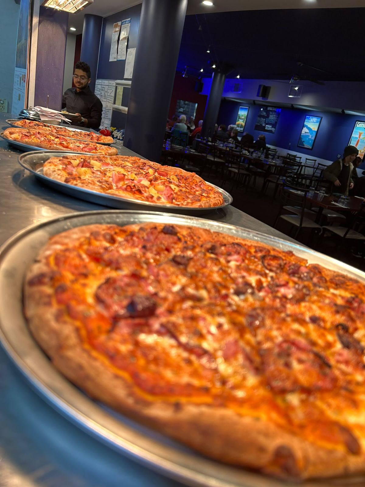 Pizzas ready for a family table at La Mensa, Hobart